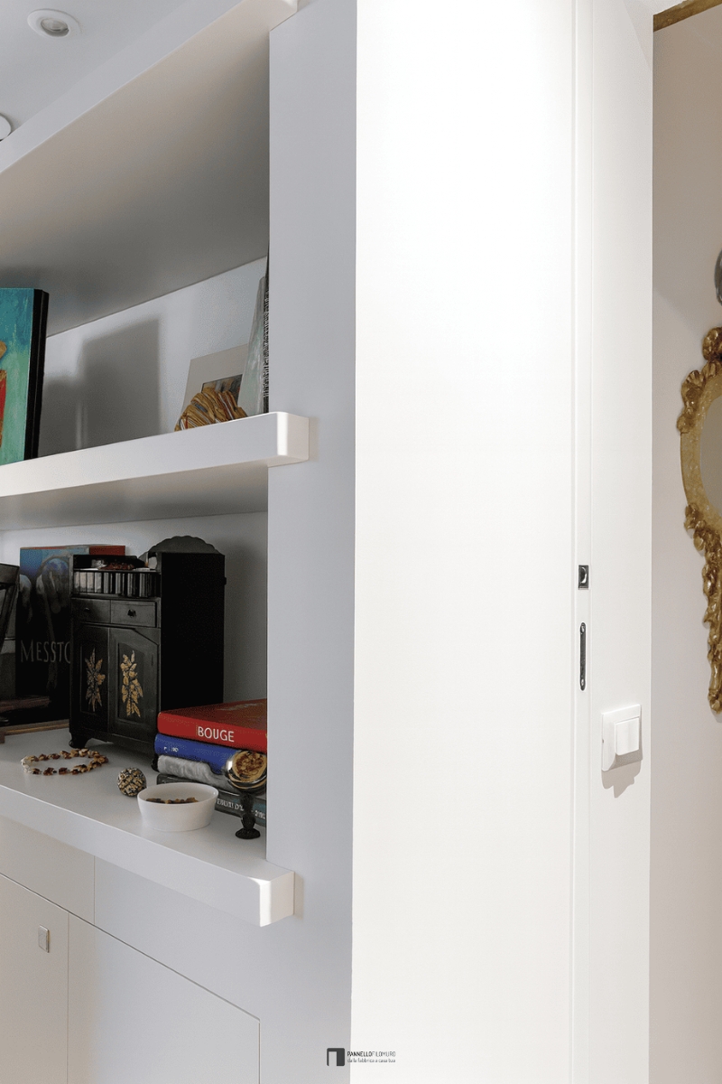 Scorrevole interno muro con parete attrezzata libreria